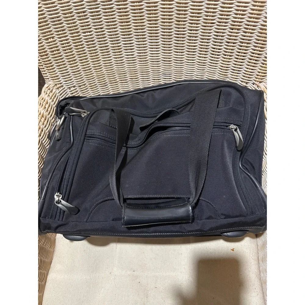 American Tourister Black Rolling Duffel Bag Travel Carry On Luggage Wheels